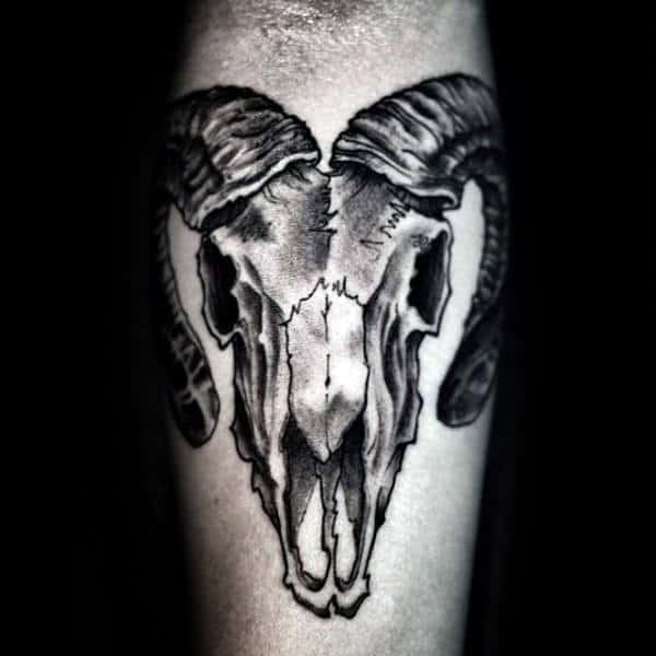A goat skull over a pattern of alchemy symbols tattoo idea | TattoosAI