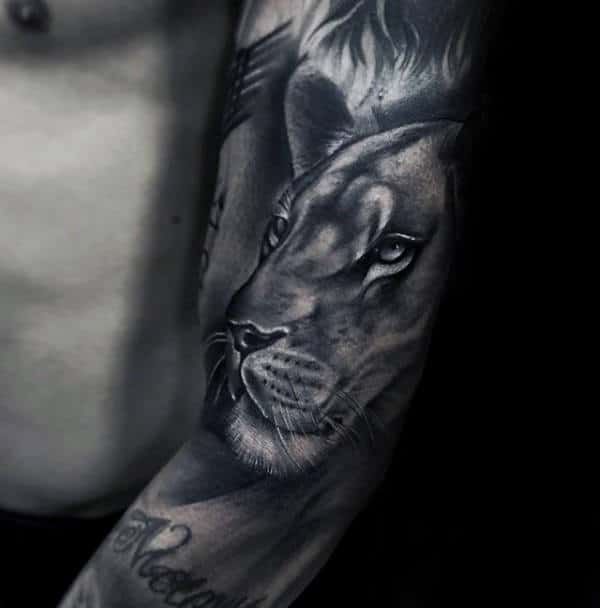 Shaded Grey And White Ink Sleeve Tattoo Of Lion On Man