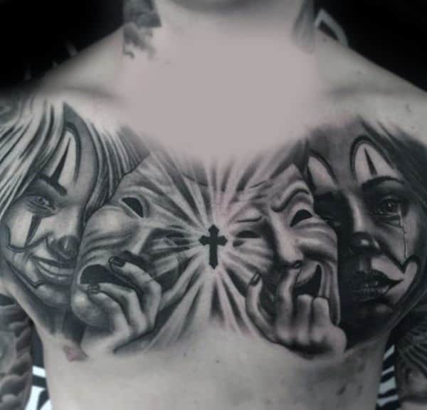 Shaded Mask Chicano Tattoo On Mans Chest With Cross