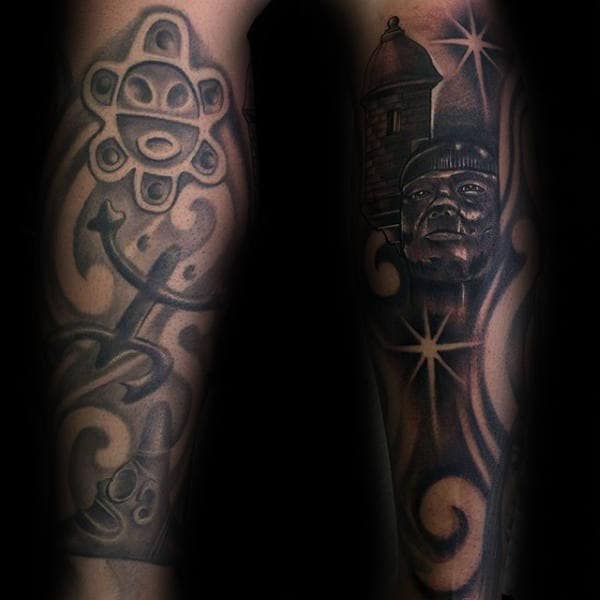 Shaded Negative Space Male Taino Sleeve Tattoo On Forearm