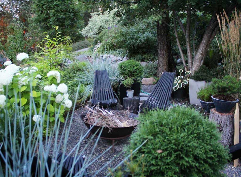 fire pit in large shaded garden 