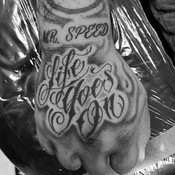 Shaded Script Hand Life Goes On Tattoos For Males