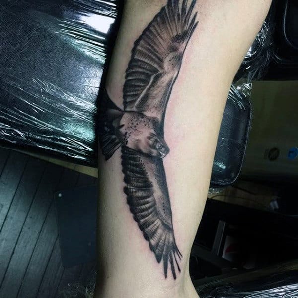 Shaded Soaring Hawk Tattoo On Males Forearm