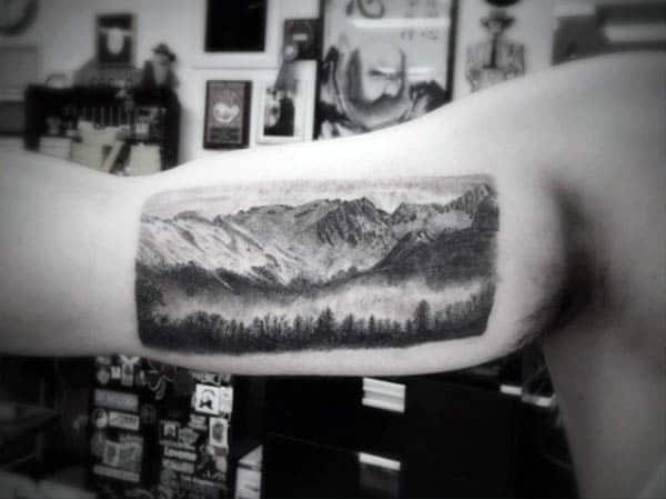 Shaded Tattoo On Biccep Of Landscape For Guys