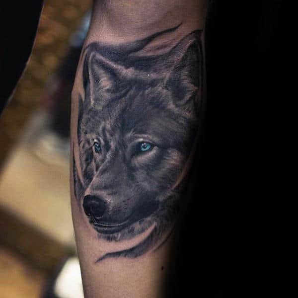 Shaded Wolf With Blue Eyes Mens Inner Forearm Tattoo