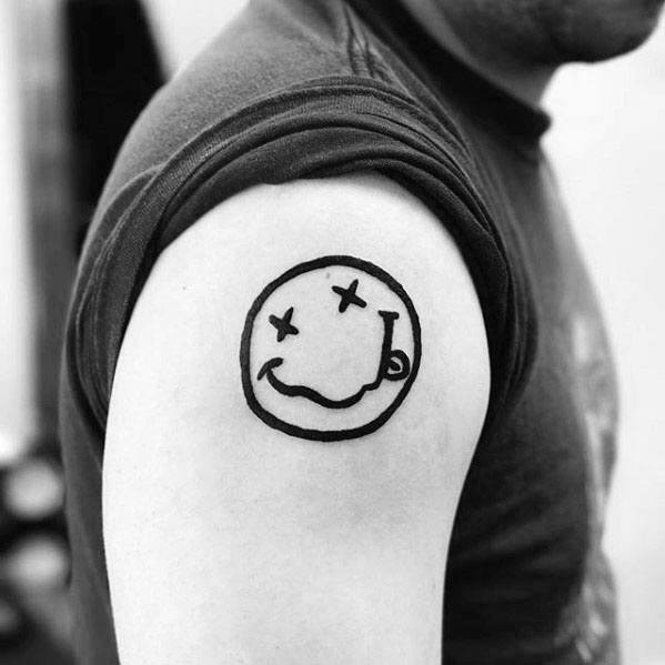 Nirvanas smiley face symbol tattooed on the inner