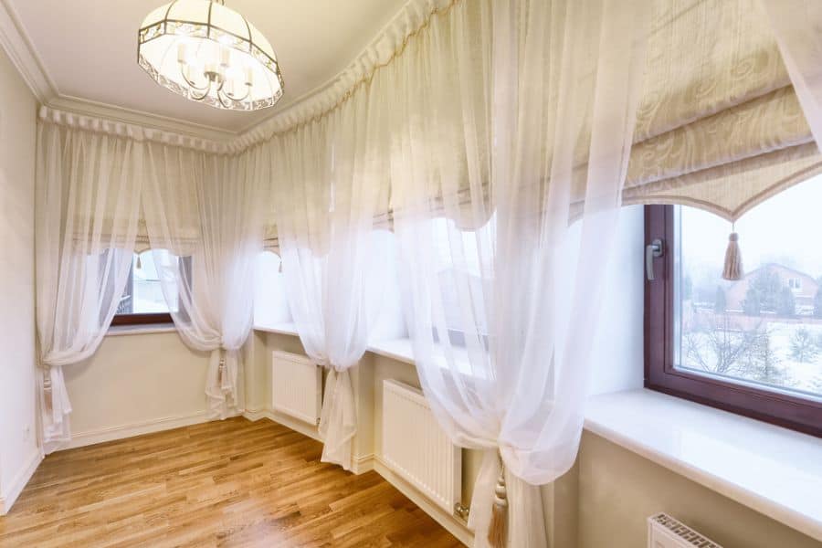 sheer white curtain large empty room