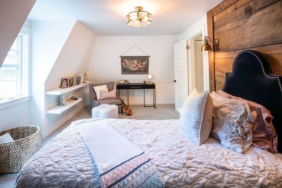 Rustic bedroom with wooden headboard, wall shelves, and cozy reading nook.