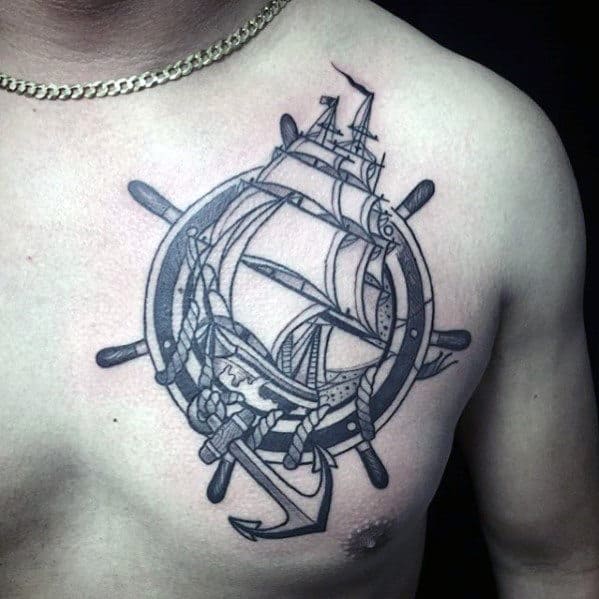 Ship Wheel With Ship And Anchor Guys Upper Chest Tattoo