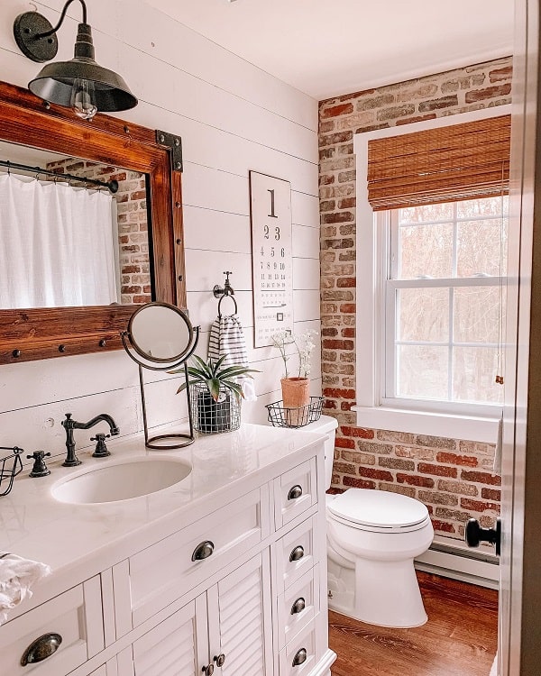 shiplap rustic farmhouse bathroom accent brick wall white vanity wall mirror