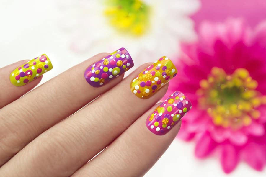 Yellow and purple polka dot nails