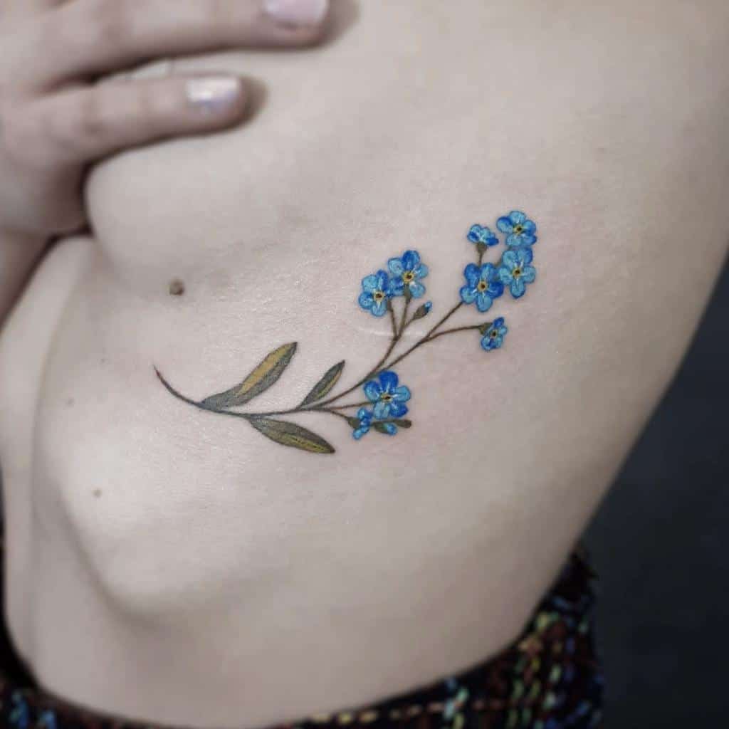 Forgetmenot flower tattoo on the inner forearm