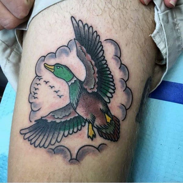 Simple American Traditional Flying Mallard Tattoo On Man