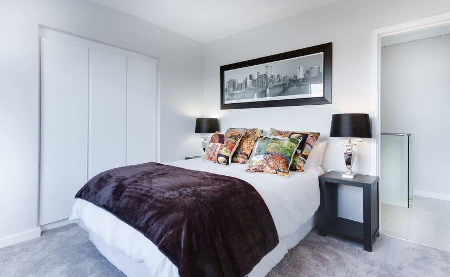 simple black and white bedroom colorful pillows