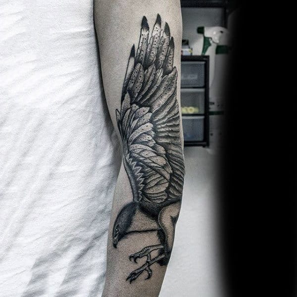 Simple Black Ink Hawk Tattoo On Male Forearm