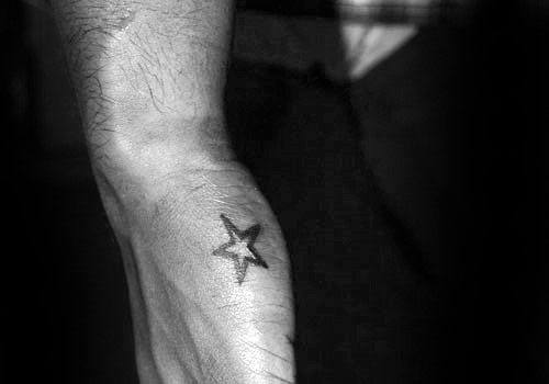 Simple Black Ink Star Mens Side Hand Tattoo Designs