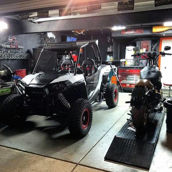 simple black garage with four wheel buggy and motorcycle 