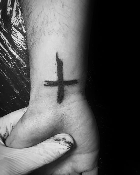 Simple Cross Paint Brush Stroke Mens Wrist Tattoos