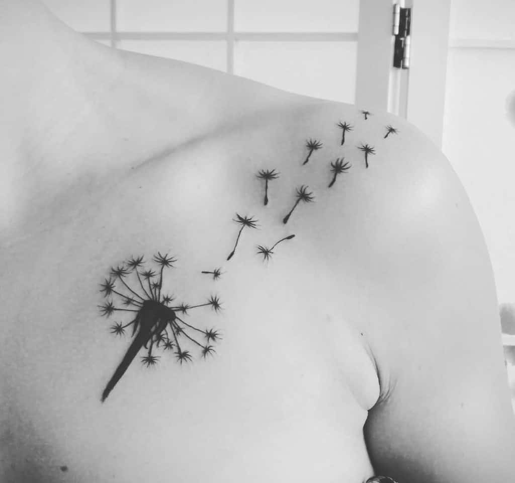 simple flower dandelion tattoo