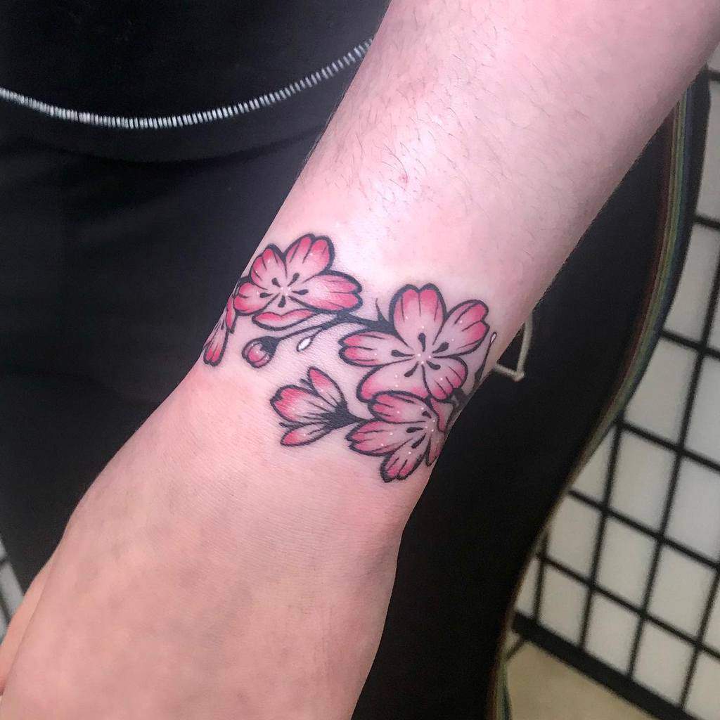 simple flower wrist tattoo kiddo.tatts