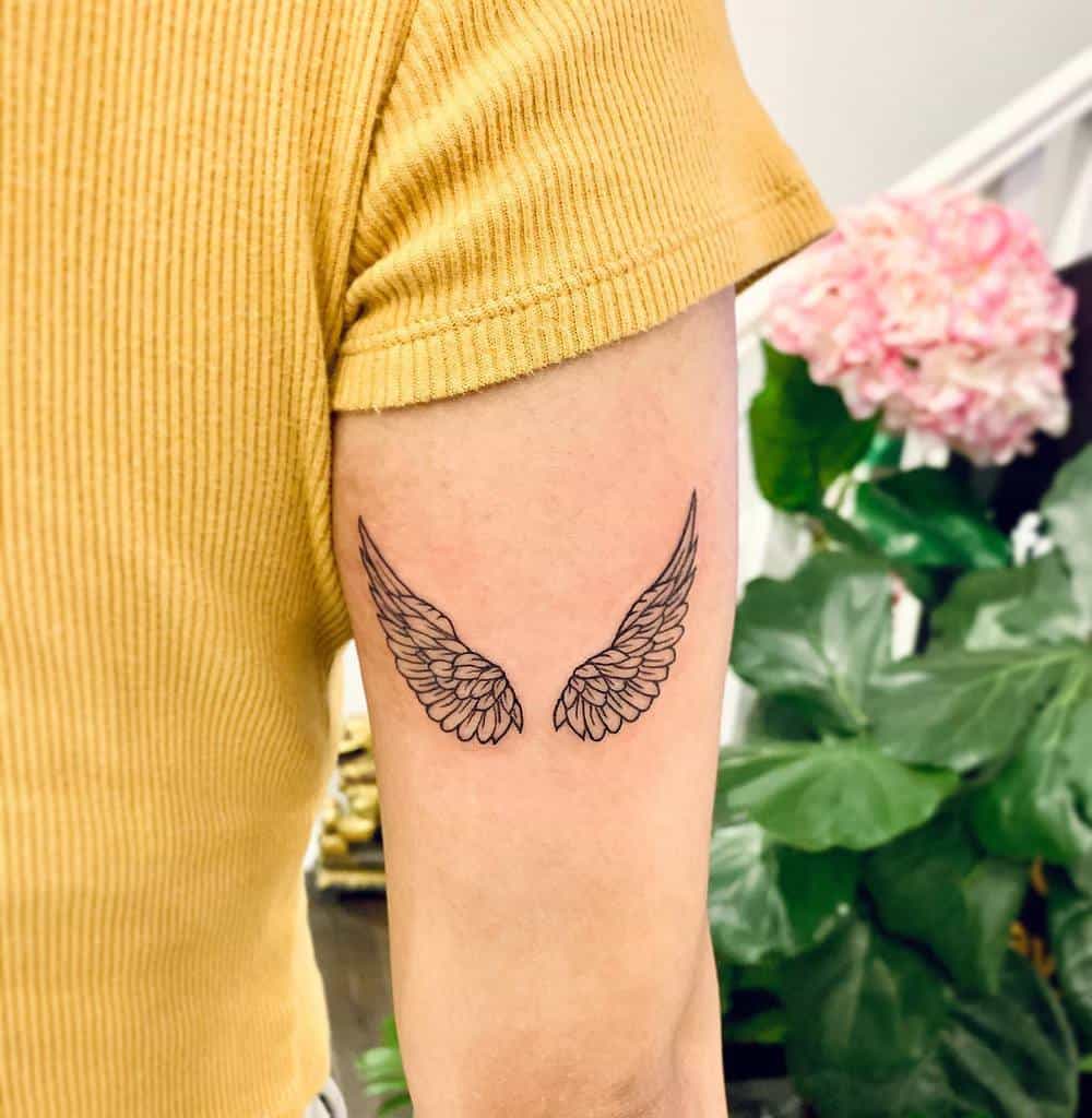 Wing tattoo on side boob