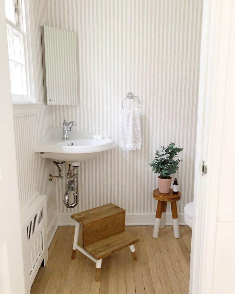 stripe wallpaper country style powder room with corner sink