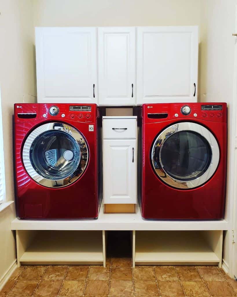 white cabinet laundry red washer and dryer