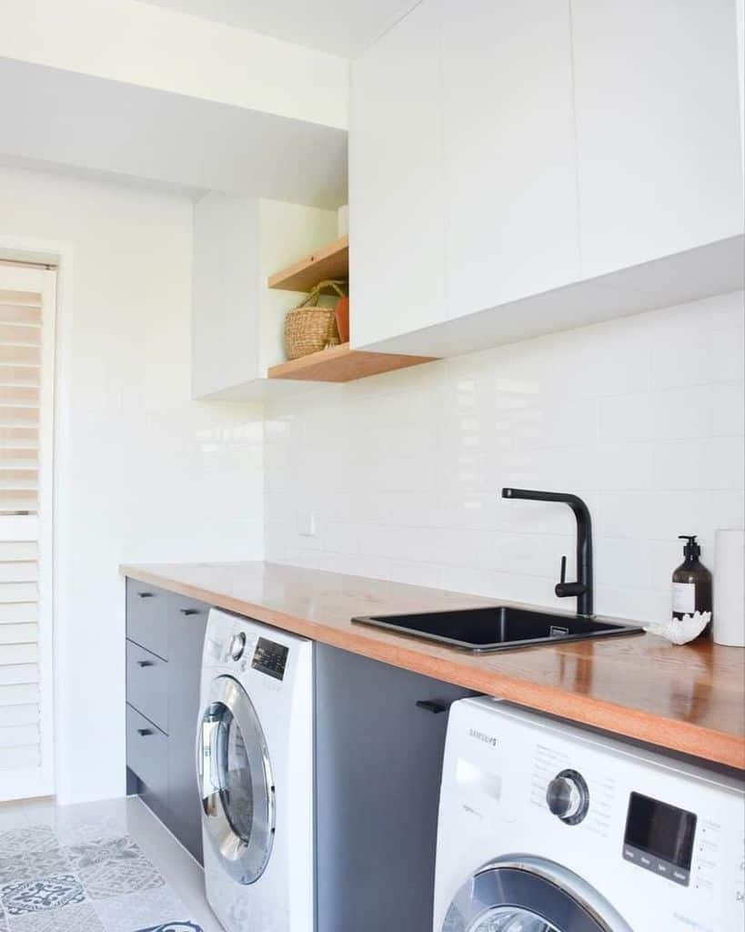 simple laundry room washer and dryer white tile backsplash