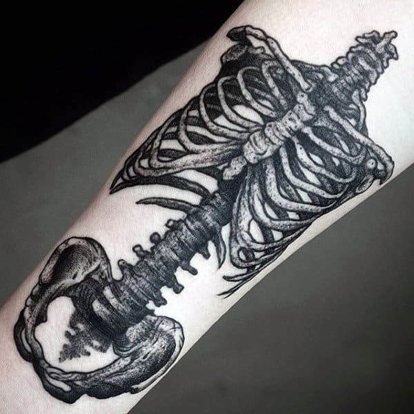 Skeleton Figure Bone Spine Tattoo On Forearm Of Man