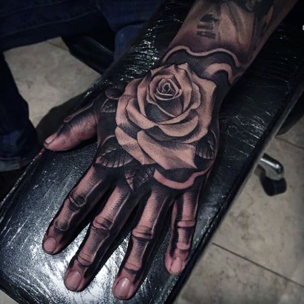 61 Skeleton Hand Tattoo Ideas With Deep Meanings