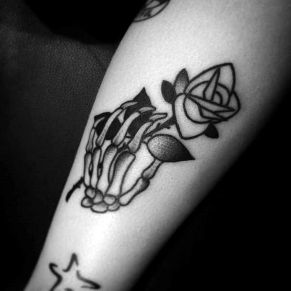 Skeleton Hands Holding Rose Flower Stem Mens Traditional Small Tattoo Ideas