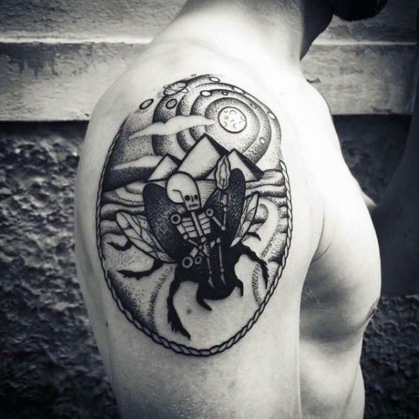 skeleton riding scarab bettle with pyramids mens upper arm tattoo