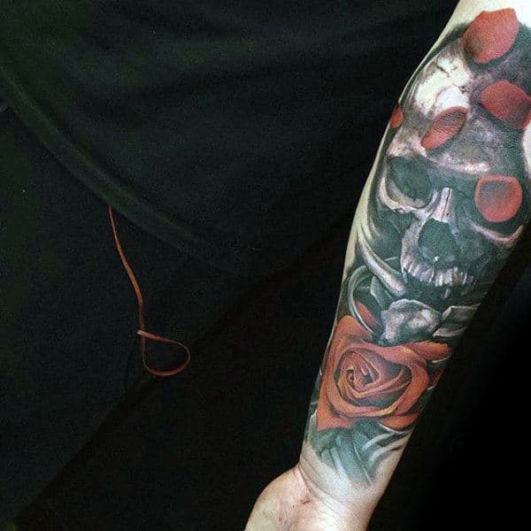 skull-arm-sleeve-tattoos-for-guys-on-forearm-with-red-rose-flowers-and-petals