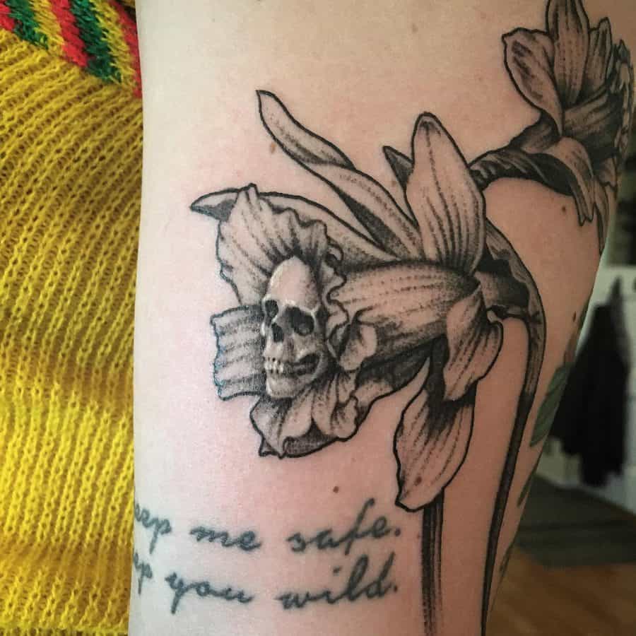 Skull Inside Flower And Script Abstract Daffodil Tattoo