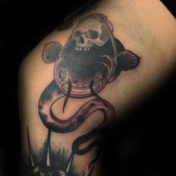 Skull With Catfish Guys Thigh And Leg Tattoo