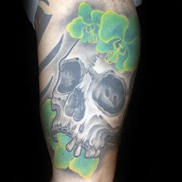 Skull With Green Orchids Mens Inner Arm Tattoo