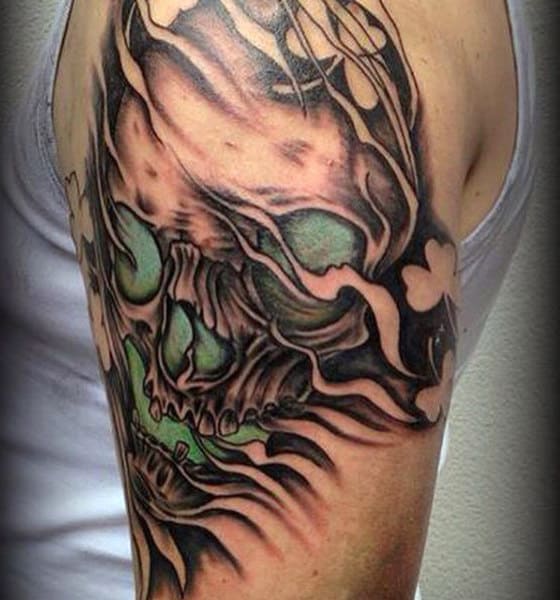 Skull With Negative Space Shamrocks Tattoo On Male
