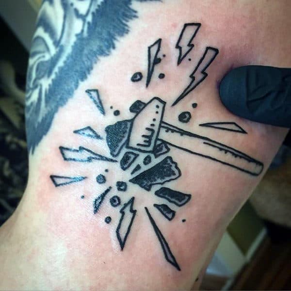 Sledgehammer Smashing Through Stone Mens Small Tattoo On Arm
