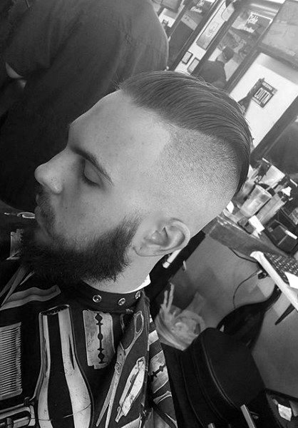 Slicked Back Skin Fade Haircut For Males