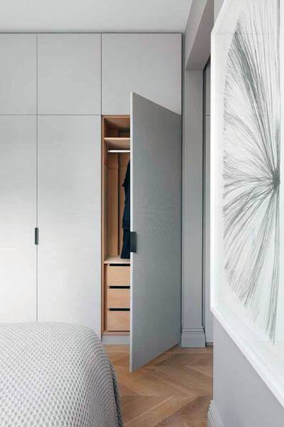 modern bedroom closet behind secret door