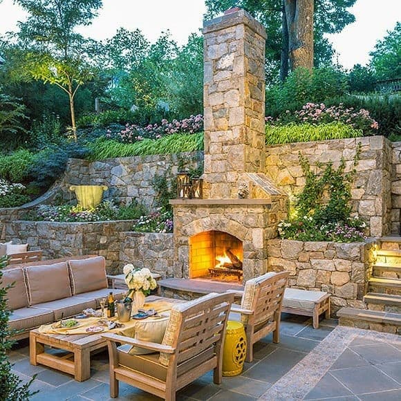 Sloped Backyard Designs Stone Patio Fireplace