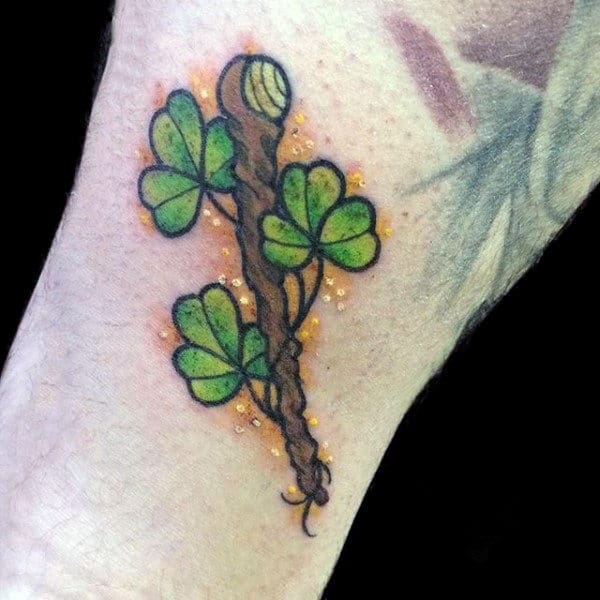 Smal Shamrock With Wood Branch Mens Wrist Tattoo