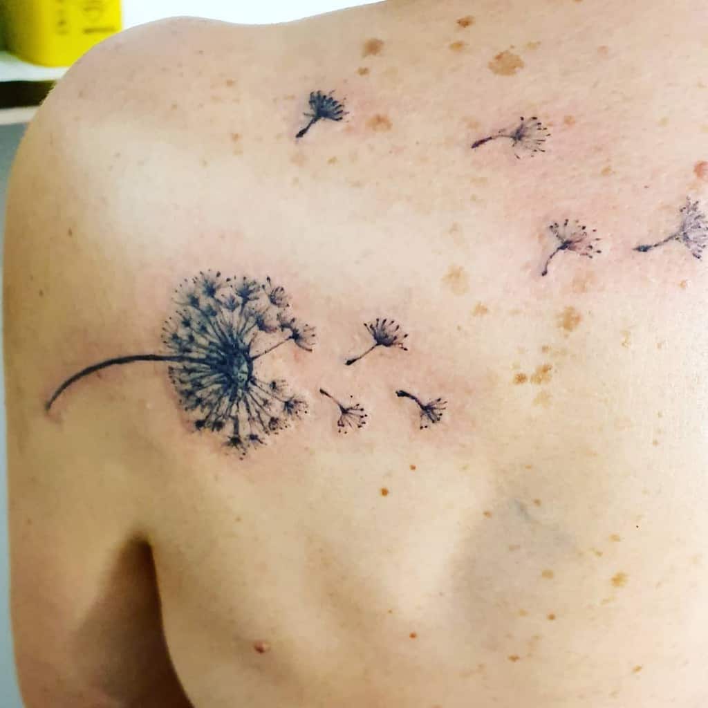 small back dandelion tattoo