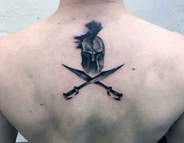Small Back Spartan Tattoo On Man