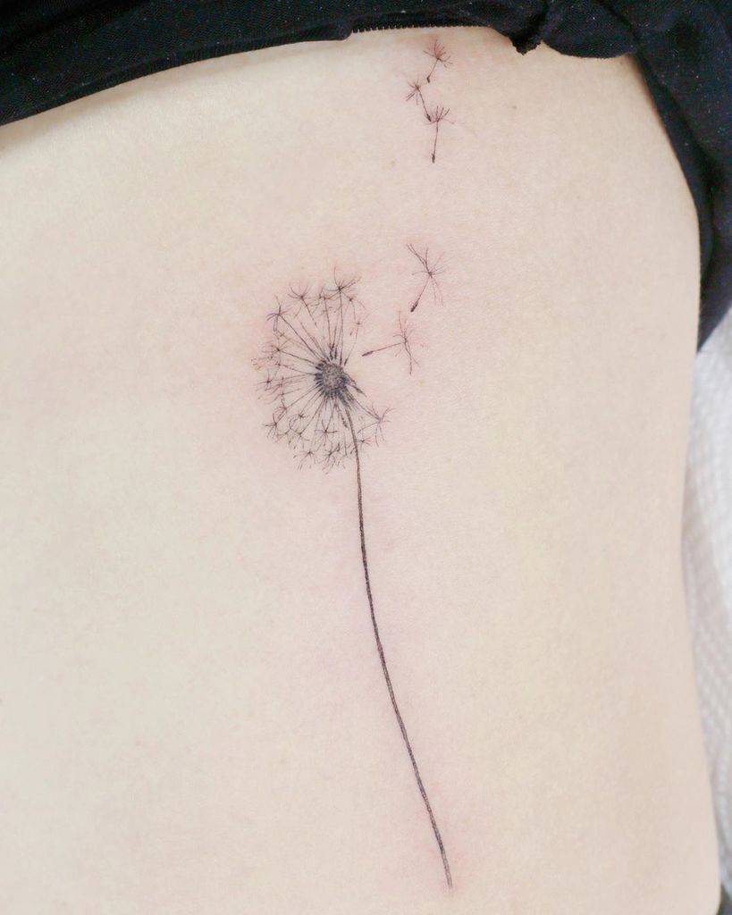 small black dandelion tattoo