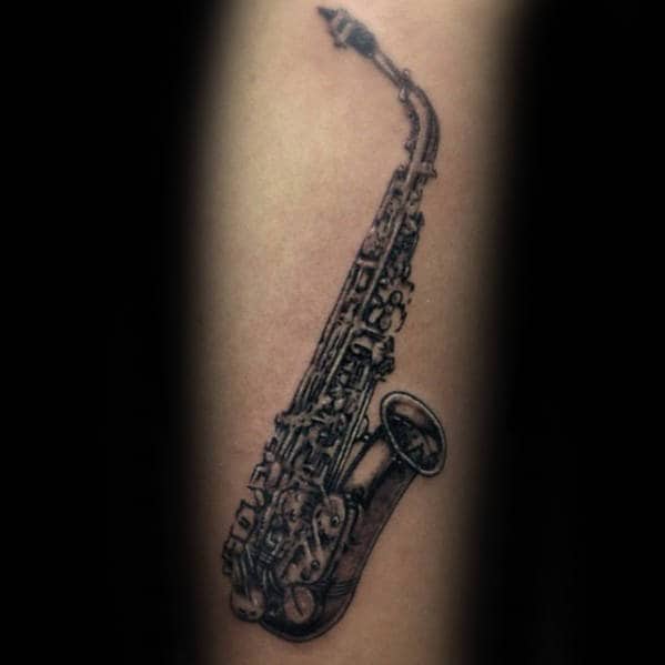 Small Detailed Saxophone Tattoo On Gentleman