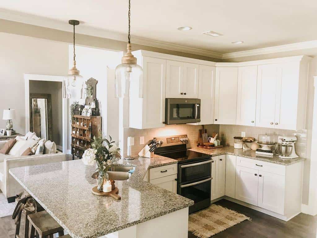 open kitchen living room white cabinets pendant lights granite countertop 