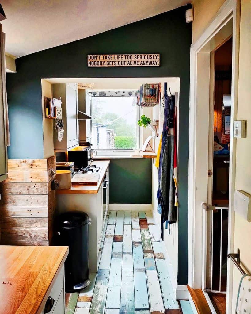 small kitchen green walls hardwood floor