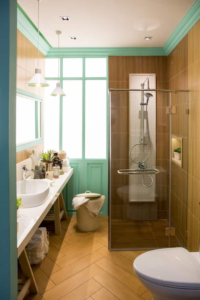 vintage bathroom with green accents and long vanity 