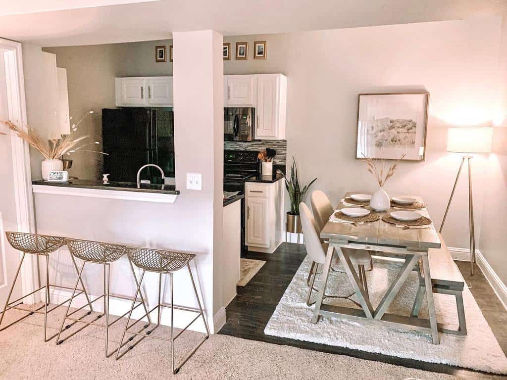 small galley kitchen open plan dinging room breakfast bar dining room table and chairs beige